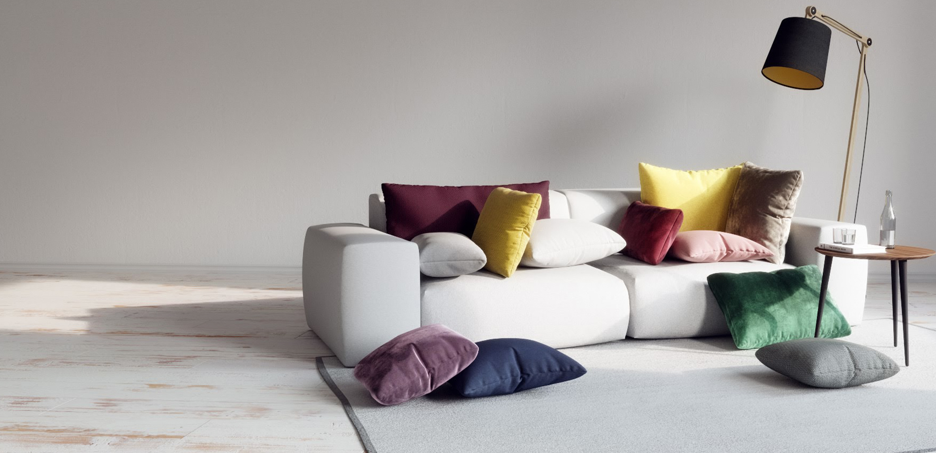 graues TYME Sofa mit bunten Kissen und Couchtisch von MYCS
